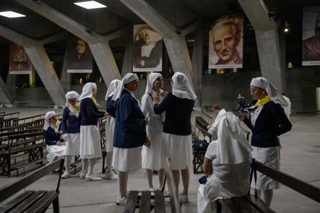 Worshippers gather for a mass at the basilique Saint Pie, in Lourdes on September 26, 2026. (Photo by Ed JONES / AFP)