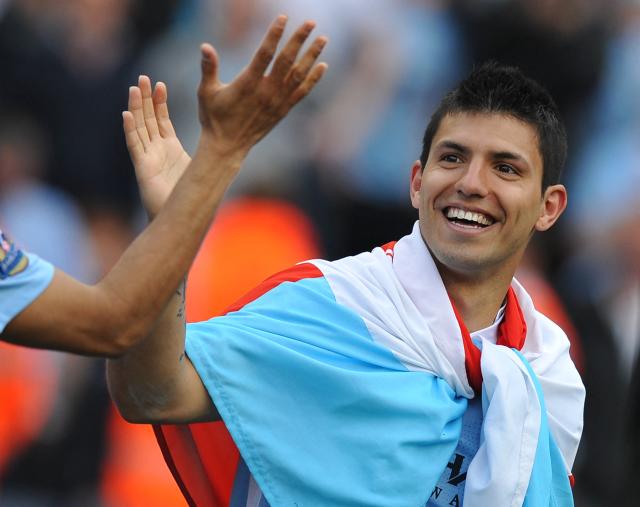 (FILES) Manchester City's Argentinian striker Sergio Aguero celebrates on the pitch after their 3-2 victory over Queens Park Rangers at The Etihad stadium in Manchester, north-west England on May 13, 2012. Manchester City won the game 3-2 to secure their first title since 1968. This is the first time that the Premier league title has been decided on goal-difference, Manchester City and Manchester United both finishing on 89 points. Manchester City have been found guilty of all but one of 115 Premier League charges they face for breaching financial regulations, the Athletic reported on Friday, September 25, 2026. (Photo by Paul ELLIS / AFP)