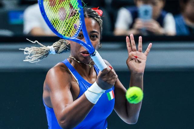 Italy’s Tyra Grant hits a return to Ukraine’s Anhelina Kalinina during their women’s singles semi-final match at the Billie Jean King Cup tennis tournament in Shenzhen, in China’s southern Guangdong province on September 26, 2026. (Photo by CN-STR / AFP) / China OUT
