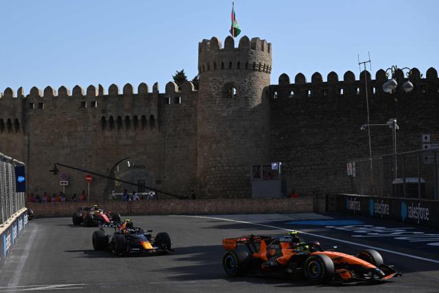McLaren's British driver Lando Norris, Red Bull Racing's French driver Isack Hadjar and Ferrari's British driver Lewis Hamilton compete during the Formula One Azerbaijan Grand Prix at the Baku City Circuit in Baku on September 26, 2026. (Photo by Igor IVANKO / AFP)