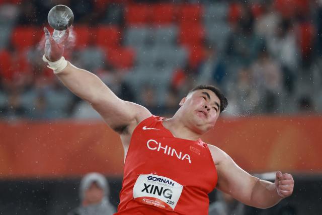 China's Xing Jialiang competes in the men's shot put final during the 2026 Asian Games at Nagoya City Mizuho Park Athletic Stadium in Nagoya, Aichi Prefecture on September 26, 2026. (Photo by DAVID GRAY / AFP)