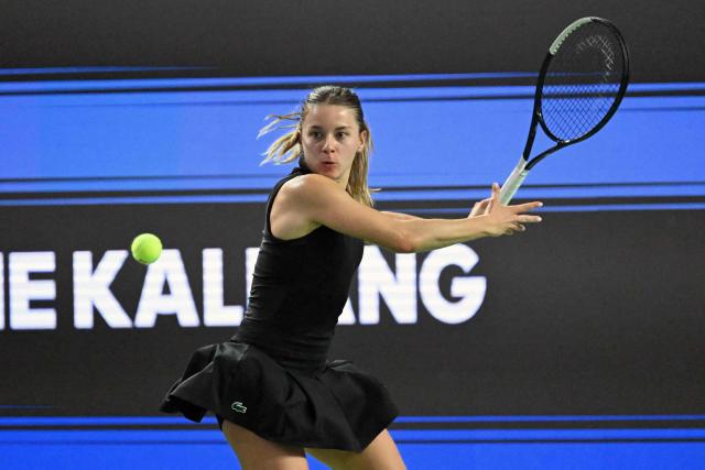 Poland's Maja Chwalinska hits a return against Canada's Leylah Fernandez during the WTA Singapore Open Tennis semifinal in Singapore on September 26, 2026. (Photo by Roslan RAHMAN / AFP)