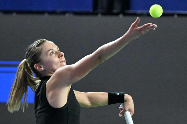 Poland's Maja Chwalinska serves a shot against Canada's Leylah Fernandez during the WTA Singapore Open Tennis semifinal in Singapore on September 26, 2026. (Photo by Roslan RAHMAN / AFP)
