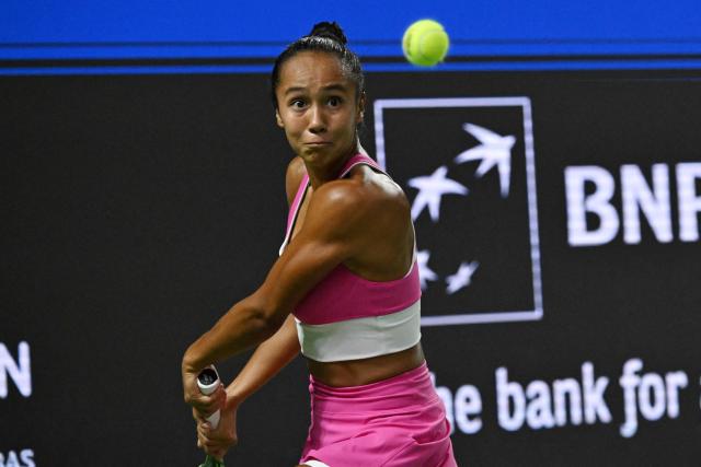 Canada's Leylah Fernandez returns a shot against Poland's Maja Chwalinska during the WTA Singapore Open Tennis semifinal in Singapore on September 26, 2026. (Photo by Roslan RAHMAN / AFP)
