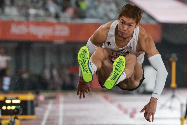 South Korea's Kim Jang-woo competes in the men's triple jump final during the 2026 Asian Games at Nagoya City Mizuho Park Athletic Stadium in Nagoya, Aichi Prefecture on September 26, 2026. (Photo by DAVID GRAY / AFP)