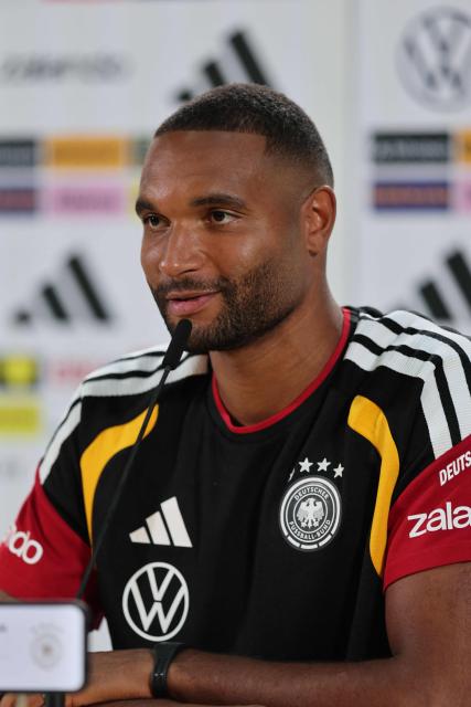 Germany's defender Jonathan Tah addresses a press conference in Herzogenaurach, southern Germany on September 26, 2026, ahead of the UEFA Nations League football match Germany v Greece on September 27. (Photo by Alexandra BEIER / AFP)
