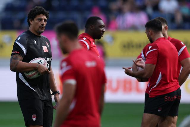 Lyon's French head coach Karim Ghezal (L) looks on prior to the French Top14 rugby union match between Stade Francais Paris and Lyon Olympique Universitaire (LOU) at the Jean-Bouin Stadium in Paris on September 26, 2026. (Photo by Anne-Christine POUJOULAT / AFP)