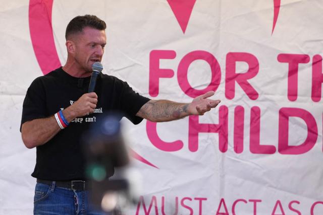 British far-right activist Tommy Robinson, real name Stephen Yaxley-Lennon speaks to the crowd in Trafalgar Square following a march organised by togetherforthechildren in central London on September 26, 2026. (Photo by CARLOS JASSO / AFP)