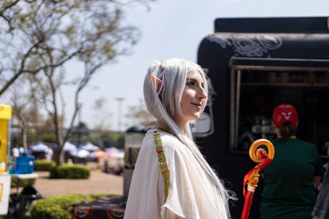 A cosplayer reacts during Comic Con Africa, one of Africa's largest pop culture, fantasy and gaming festivals, at the Johannesburg Expo Centre in Johannesburg on September 26, 2026. Comic Con Africa is a pop culture and gaming convention that brings together fans of comics, films, television, gaming, cosplay and related entertainment, attracting exhibitors, creators and enthusiasts from across Africa and beyond. (Photo by Cecilia Seregni / AFP)