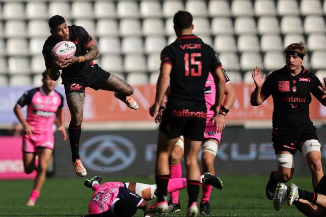 Lyon's Australian wing Monty Ioane jumps for the ball the French Top14 rugby union match between Stade Francais Paris and Lyon Olympique Universitaire at the Jean-Bouin Stadium in Paris on September 26, 2026. (Photo by Anne-Christine POUJOULAT / AFP)