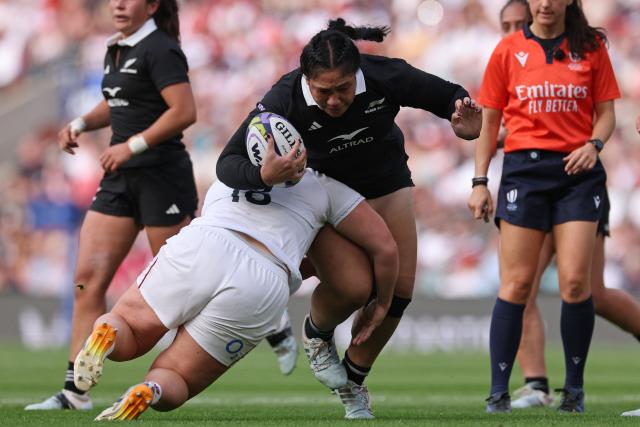 New Zealand's prop Veisinia Mahutariki-Fakalelu is tackled by England's prop Maud Muir during the Women's WXV Global Series international rugby union match between England and New Zealand at the Allianz Stadium, Twickenham, south-west London, on September 26, 2026. (Photo by Adrian DENNIS / AFP)