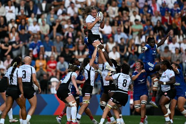 Canada's lock Rachel Smith (C,up) grabs the ball during the women's WXV Global Series rugby match between France and Canada at the Stade Marcel Deflandre, in La Rochelle, central-eastern France, on September 26, 2026. (Photo by Christophe ARCHAMBAULT / AFP)