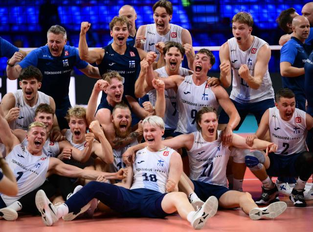 Finland's team celebrates after winning the CEV EuroVolley 2026 men's bronze medal volleyball match final between Finland and Slovenia at the Forum of Assago, on September 26, 2026. (Photo by Marco BERTORELLO / AFP)