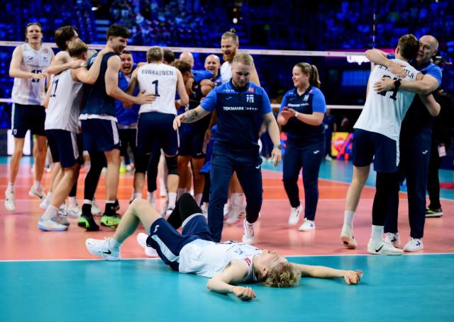 Finland's team celebrates after winning the CEV EuroVolley 2026 men's bronze medal volleyball match final between Finland and Slovenia at the Forum of Assago, on September 26, 2026. (Photo by Marco BERTORELLO / AFP)