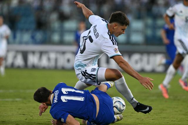 Finland's midfielder #11 Adam Marhiev fights for the ball with San Marino's defender #15 Marco Pasolini during the UEFA Nations League (League C, Group 1) football match between San Marino and Finland at the Serravalle's stadium in San Marino, on September 26, 2026. (Photo by Andreas SOLARO / AFP)