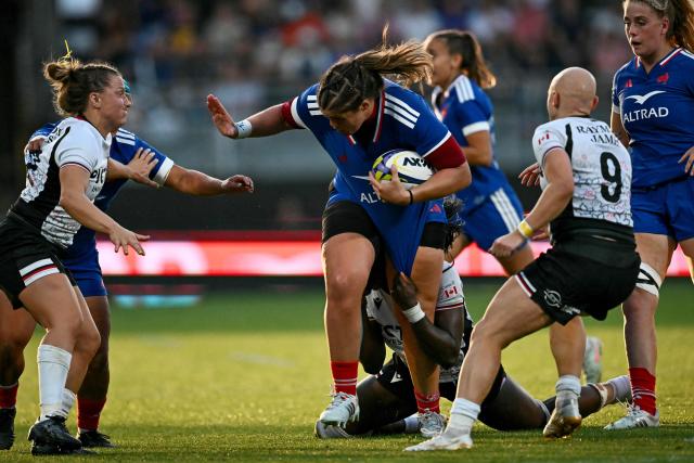 France's prop Annaelle Deshaye (C) runs with the ball during the women's WXV Global Series rugby match between France and Canada at the Stade Marcel Deflandre, in La Rochelle, central-eastern France, on September 26, 2026. (Photo by Christophe ARCHAMBAULT / AFP)
