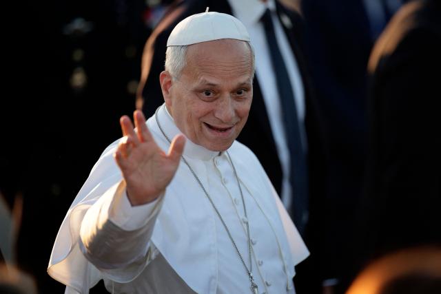 Pope Leo XIV waves as he disembarks from the plane upon arrival at the Tarbes-Lourdes-Pyrenees International Airport, in Tarbes, southwestern France, on September 26, 2026 to travel to Lourdes, the second leg of his papal visit to France. (Photo by Valentine CHAPUIS / AFP)