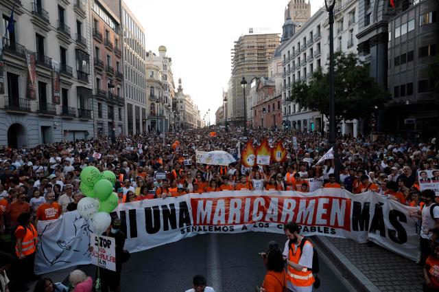 Demonstrators protest against evictions and the housing crisis in Madrid on September 26, 2026. The banner reads 'Not a single more Maricarmen' in a reference to an 87-year-old evicted from her Madrid home. Spain's main tenants' unions on September 25 urged the government to pass a new law to tackle the country's housing crisis after an 87-year-old was evicted from her Madrid home, sparking nationwide protests. (Photo by Oscar DEL POZO / AFP)