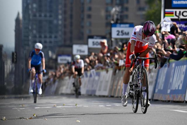Poland’s Kasia Niewiadoma-Phinney (R) and Italy’s Elisa Longo Borghini react at the finish line after finishing second and third, respectively, in the women’s elite road race during the 2026 Union Cycliste Internationale (UCI) Road World Championships in Montreal, Quebec, on September 26, 2026. (Photo by Andrej Ivanov / AFP)