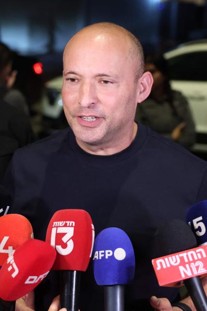 Former Israeli prime minister Naftali Bennett, speaks to the media outside the house of former Israeli prime minister and opposition leader Yair Lapid, after attending a meeting for the leaders of the Change Bloc, also known as Gush HaShinui or the anti-Netanyahu bloc, ahead of Israel's legislative elections, in the coastal city of Tel Aviv on September 26, 2026. Israel heads to the polls on October 27 in its first election since the October 7, 2023 Hamas-led attack, in what is seen as a referendum on Prime Minister Benjamin Netanyahu. (Photo by Jack GUEZ / AFP)
