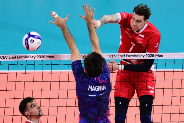 Poland's Middle Blocker #07 Bartlomiej Lemanski spikes the ball during the CEV EuroVolley 2026 men's gold medal final volleyball match between France and Poland at the Forum of Assago, on September 26, 2026. (Photo by Marco BERTORELLO / AFP)