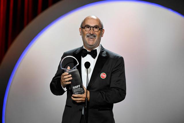 Spanish actor Javier Camara celebrates on stage after receiving the "Concha de Plata" (Silver Shell), best supporting performance award, for his role in "5 minutos mas" (5 minutes more) during the 74th San Sebastian International Film Festival closing ceremony in the northern Spanish Basque city of San Sebastian on September 26, 2026. (Photo by ANDER GILLENEA / AFP)