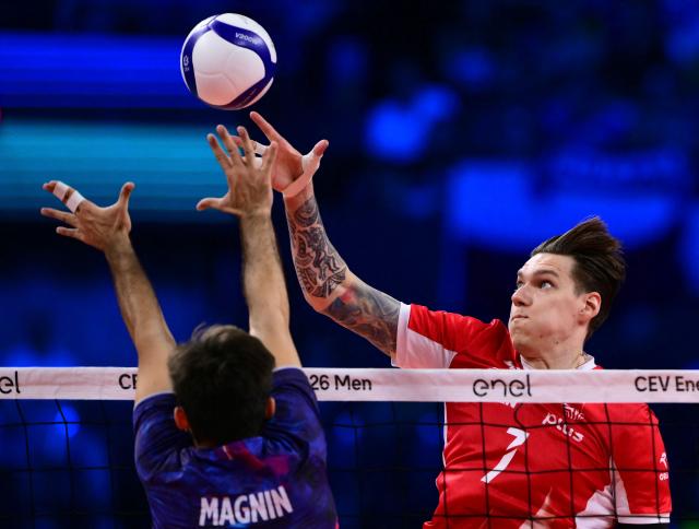 Poland's Middle Blocker #07 Bartlomiej Lemanski spikes the ball during the CEV EuroVolley 2026 men's gold medal final volleyball match between France and Poland at the Forum of Assago, on September 26, 2026. (Photo by Marco BERTORELLO / AFP)