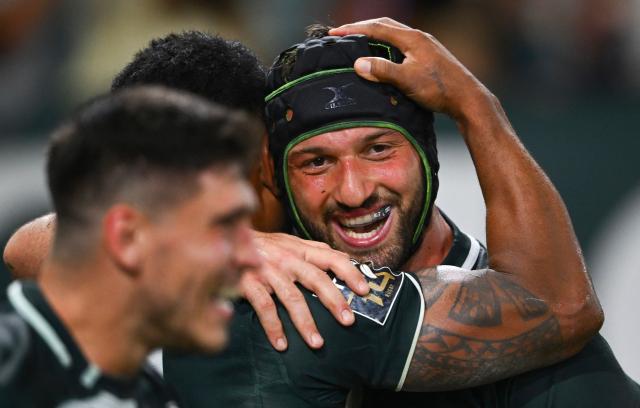 Pau's Georgian flanker Beka Gorgadze celebrates with teammates after scoring a try during the French Top14 rugby union match between Section Paloise and Stade Rochelais (La Rochelle) at the Stade du Hameau in Pau, south-western France on September 26, 2026. (Photo by Gaizka IROZ / AFP)
