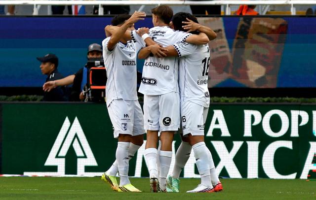 Queretaro players celebrate their opening goal during the Liga MX Apertura tournament football match between Guadalajara and Queretaro at the Akron Stadium in Zapopan, Mexico on September 26, 2026. (Photo by ULISES RUIZ / AFP)