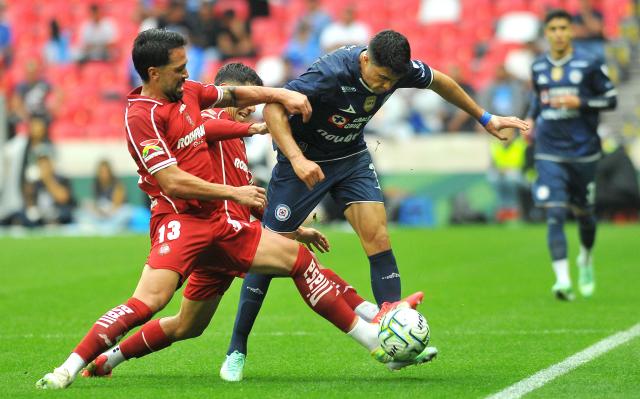 Toluca's Brazilian defender #13 Luan and Cruz Azul's forward #07 Nicolas Ibanez fight for the ball during the Liga MX Apertura tournament football match between Cruz Azul and Toluca at the Banorte Stadium in Mexico City on September 26, 2026. (Photo by Victor CRUZ / AFP)