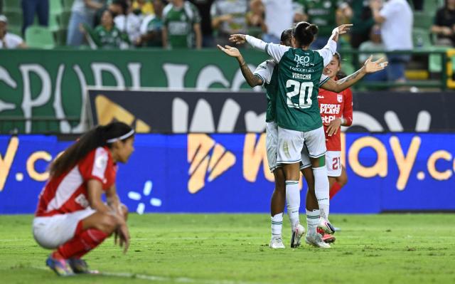 Deportivo Cali players celebrate their third goal during the Colombian women's football league second leg final match between Deportivo Cali and Independiente Santa Fe at the Deportivo Cali Stadium in Cali, Colombia on September 26, 2026. (Photo by JOAQUIN SARMIENTO / AFP)
