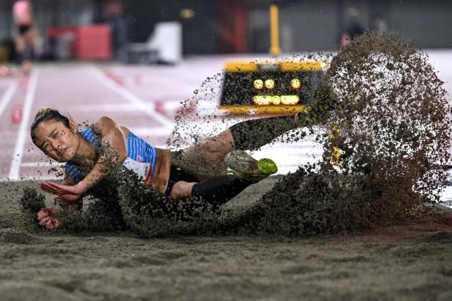 Hong Kong's Yue Nga Yan competes in the women's long jump final during the 2026 Asian Games at Nagoya City Mizuho Park Athletic Stadium in Nagoya, Aichi Prefecture on September 27, 2026. (Photo by MOHD RASFAN / AFP)