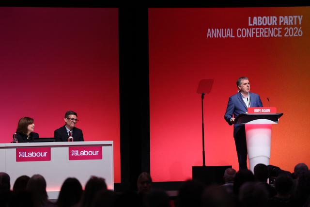 Deputy Labour party leader Lucy Powell (L) and Britain's Prime Minister Andy Burnham (2L) listen to Liverpool mayor Steve Rotheram (R) speaking on stage on the first day of the annual Labour Party conference in Liverpool, north-west England, on September 27, 2026. Britain's ruling Labour Party gathers Sunday for its first annual conference under Andy Burnham's leadership, heartened by his start as prime minister but now looking for concrete plans to tackle looming challenges. (Photo by Darren Staples / AFP)