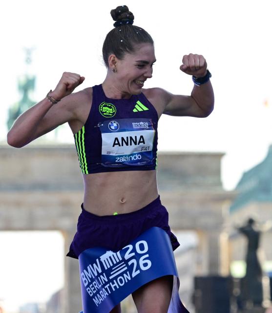 Germany's Anna Langerwisch reacts as she crosses the finish line of the women's race during the 52nd edition of the Berlin Marathon in Berlin, Germany on September 27, 2026. (Photo by John MACDOUGALL / AFP)