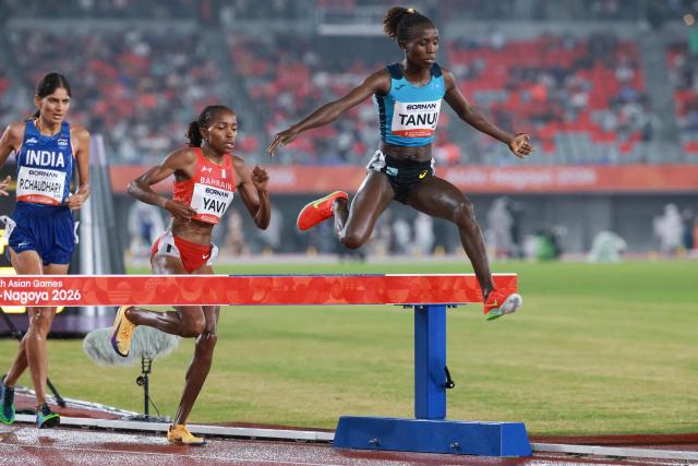 Kazakhstan's Norah Jeruto Tanui (R), Bahrain's Winfred Yavi (C) and India's Parul Chaudhary compete in the women's 3000m steeplechase final during the 2026 Asian Games at Nagoya City Mizuho Park Athletic Stadium in Nagoya, Aichi Prefecture on September 27, 2026. (Photo by DAVID GRAY / AFP)