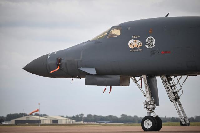 A US Air Force B-1 Lancer bomber is pictured on the tarmac at RAF Fairford base in Fairford, south-west England on September 27, 2026, as UK counter-terrorism police investigate an incident near the base in the village of Whelford. British police on September 27 declared a major incident and evacuated villagers living near a base used by the US air force after arresting several men on suspicion of explosives offences. (Photo by JUSTIN TALLIS / AFP)