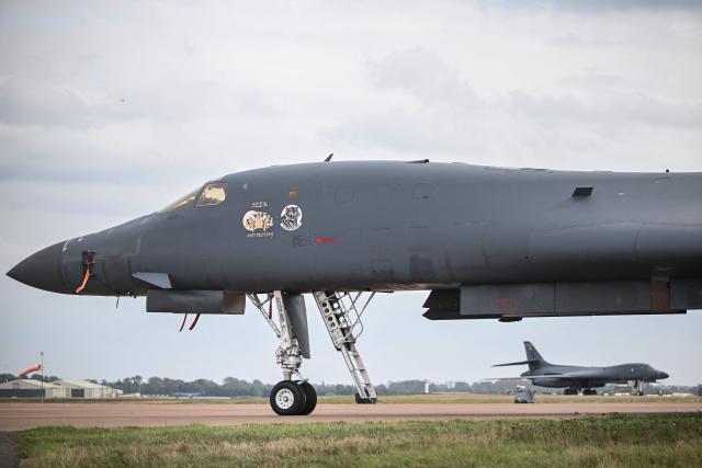 A US Air Force B-1 Lancer bomber is pictured on the tarmac at RAF Fairford base in Fairford, south-west England on September 27, 2026, as UK counter-terrorism police investigate an incident near the base in the village of Whelford. British police on September 27 declared a major incident and evacuated villagers living near a base used by the US air force after arresting several men on suspicion of explosives offences. (Photo by JUSTIN TALLIS / AFP)