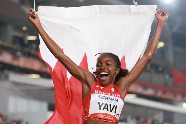 Bahrain's Winfred Yavi celebrates setting a games record after winning the women's 3000m steeplechase final during the 2026 Asian Games at Nagoya City Mizuho Park Athletic Stadium in Nagoya, Aichi Prefecture on September 27, 2026. (Photo by DAVID GRAY / AFP)
