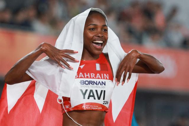 Bahrain's Winfred Yavi celebrates setting a games record after winning the women's 3000m steeplechase final during the 2026 Asian Games at Nagoya City Mizuho Park Athletic Stadium in Nagoya, Aichi Prefecture on September 27, 2026. (Photo by DAVID GRAY / AFP)