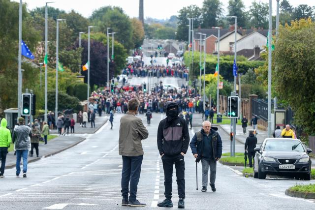 Protesters continue to block the Garvaghy Road in Portadown, Northern Ireland on September 27, 2026, preventing a parade of marchers from the Orange Order using the route through the mainly nationalist area of the town. A parade by Northern Ireland's pro-British Protestant Orange Order was set to pass through a mainly Catholic and nationalist area on Sunday for the first time since 1997, after an overnight court ruling cleared it to proceed. The confrontation is known as the Drumcree dispute after the church attended by the marchers. (Photo by Paul Faith / AFP)