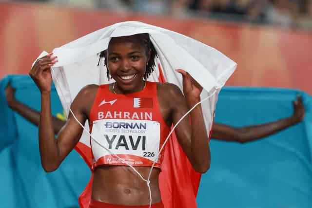 Bahrain's Winfred Yavi celebrates setting a games record after winning the women's 3000m steeplechase final during the 2026 Asian Games at Nagoya City Mizuho Park Athletic Stadium in Nagoya, Aichi Prefecture on September 27, 2026. (Photo by DAVID GRAY / AFP)