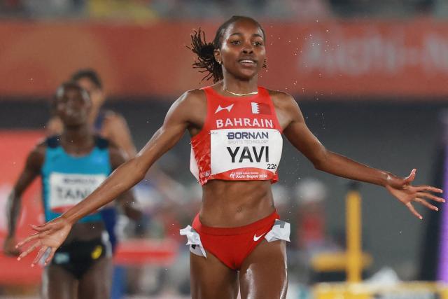 Bahrain's Winfred Yavi crosses the finish line to win the women's 3000m steeplechase final during the 2026 Asian Games at Nagoya City Mizuho Park Athletic Stadium in Nagoya, Aichi Prefecture on September 27, 2026. (Photo by DAVID GRAY / AFP)