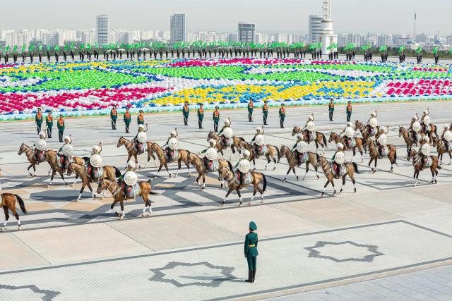 Participants ride Akhal-Teke horses during a parade marking the 35th anniversary of Turkmenistan's independence in central Ashgabat on September 27, 2026. (Photo by Nikolay VAVILOV / AFP)