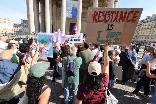 Members of collectives from the Iranian diaspora take part in a demonstration in front of the Pantheon on the occasion of the fourth anniversary of the Women, Life, Freedom movement, against repression and war, in Paris on September 27, 2026. (Photo by Mehdi FEDOUACH / AFP)