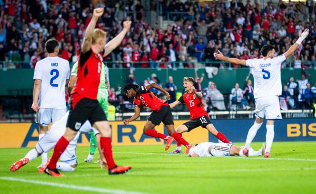 Austria's midfielder #17 Carney Chukwuemeka celebrates scoring the 3-0 with Austria's defender #15 Nikolas Veratschnig during the UEFA Nations League Group B3 football match between Austria v Kosovo in Vienna on September 27, 2026. (Photo by GEORG HOCHMUTH / APA / AFP) / Austria OUT