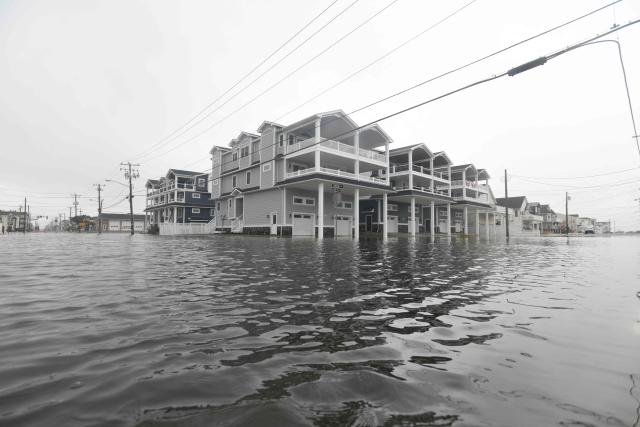 A flooded street is seen in Sea Isle, New Jersey, on September 27, 2026. A powerful autumnal storm lashed the heavily populated US Northeast corridor with wind, rain and large waves, knocking out power for thousands and killing at least one person. Nor'easters, as storms like these are known, can cause billions of dollars in damage as they bring torrential rain, sometimes snow, strong winds and heavy storm surge flooding to large swaths of the US East Coast. The National Weather Service (NWS) said Sunday morning that the storm was "slowly weakening" after causing days of havoc up and down the East Coast. (Photo by MATTHEW HATCHER / AFP)