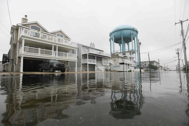 A flooded street is seen in Sea Isle, New Jersey, on September 27, 2026. A powerful autumnal storm lashed the heavily populated US Northeast corridor with wind, rain and large waves, knocking out power for thousands and killing at least one person. Nor'easters, as storms like these are known, can cause billions of dollars in damage as they bring torrential rain, sometimes snow, strong winds and heavy storm surge flooding to large swaths of the US East Coast. The National Weather Service (NWS) said Sunday morning that the storm was "slowly weakening" after causing days of havoc up and down the East Coast. (Photo by Matthew HATCHER / AFP)