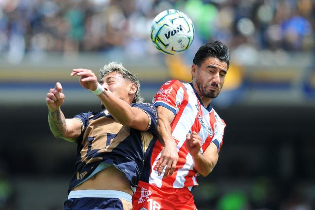 Pumas' forward #14 Luciano Herrera and San Luis' defender #18 Aldo Cruz fight for the ball during the Liga MX Apertura tournament football match between Pumas and San Luis at the Olimpico Universitario stadium in Mexico City on September 27, 2026. (Photo by Victor CRUZ / AFP)