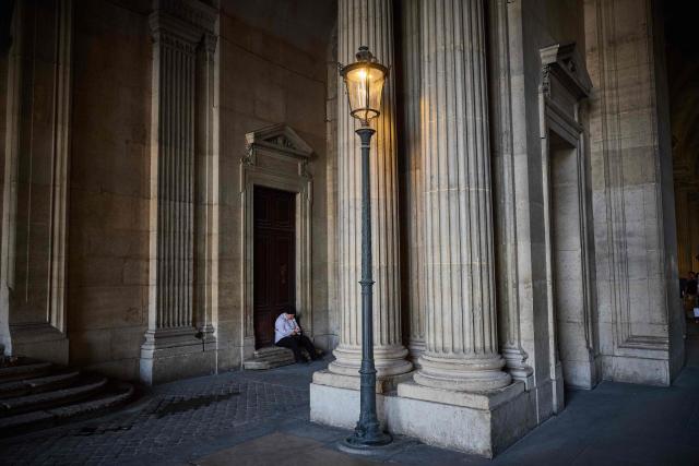 A visitor rests on the steps of the Richelieu Passage at the Louvre Museum on World Tourism Day in Paris on September 27, 2026. The Louvre remained the world’s most visited museum in 2025, welcoming more than nine million visitors. (Photo by Kiran RIDLEY / AFP)