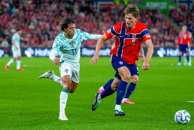 Portugal's forward #11 Joao Felix (L) and Norway's midfielder #08 Sander Berge vie for the ball during the UEFA Nations League Group A4 football match between Norway and Portugal in Oslo on September 27, 2026. (Photo by Lise Åserud / NTB / AFP) / Norway OUT